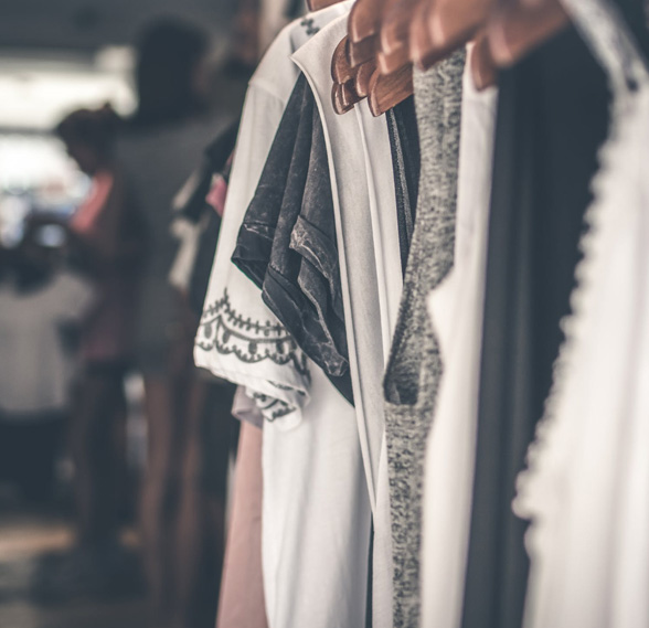 Ornate white clothes inside of a wardrobe